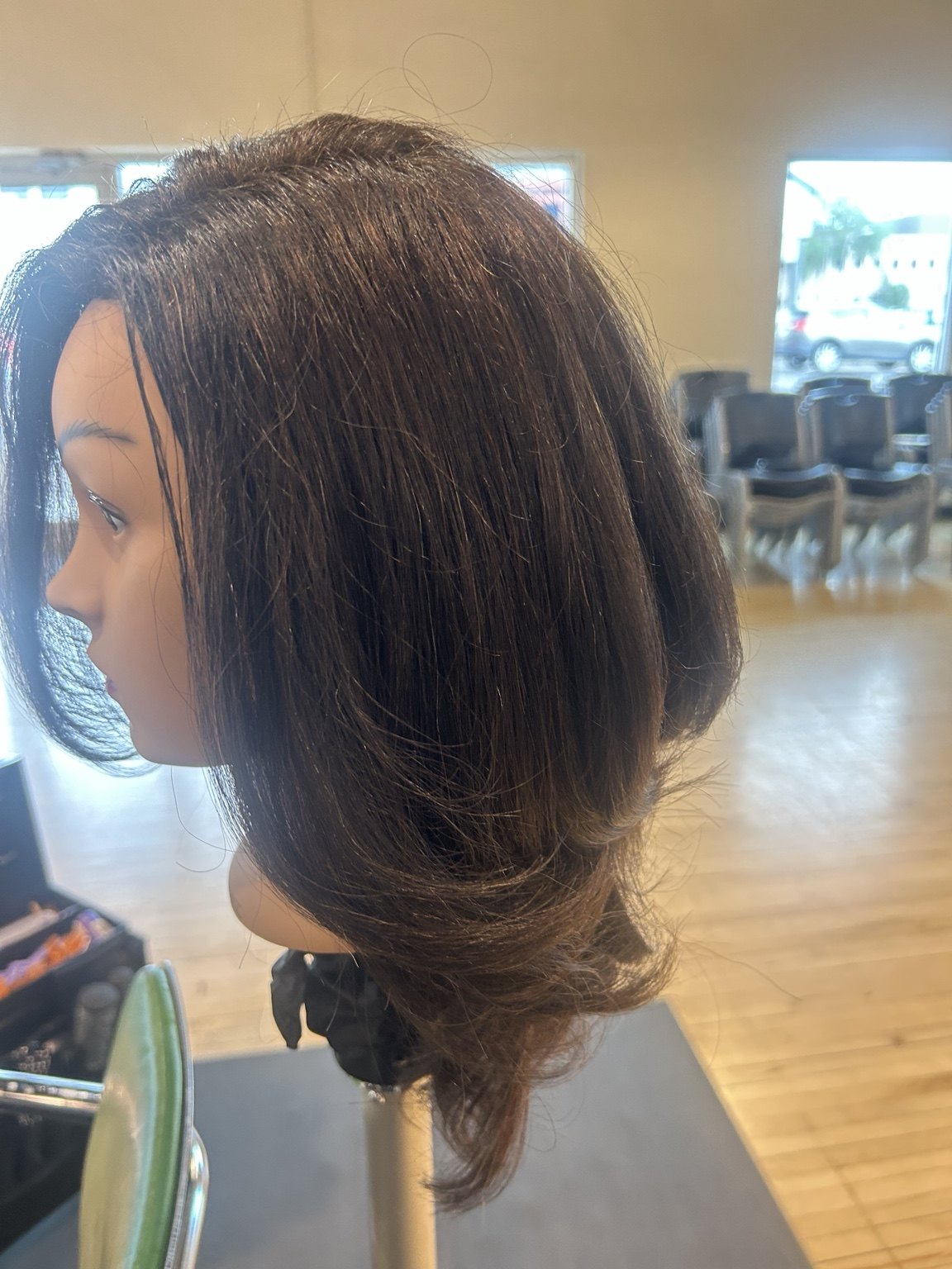 Profile view of precision bob haircut